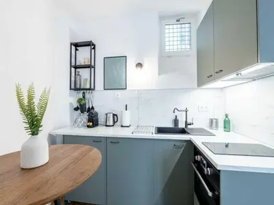 Cuisine ou kitchenette dans l'établissement Cosy Studio 2p Le Marais