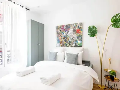Un ou plusieurs lits dans un hébergement de l'établissement Cosy Studio 2p Le Marais