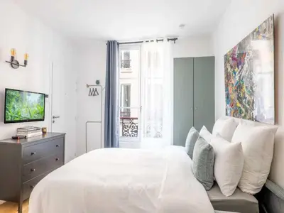 Télévision ou salle de divertissement dans l'établissement Cosy Studio 2p Le Marais