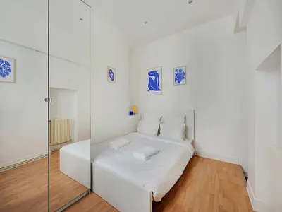 Un ou plusieurs lits dans un hébergement de l'établissement Beautiful apartment in the Marais - 3BDR 6P - PARIS