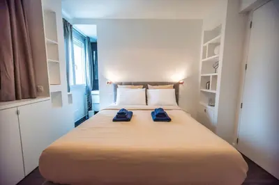 Un ou plusieurs lits dans un hébergement de l'établissement Appartement cosy&design climatisation Montparnasse