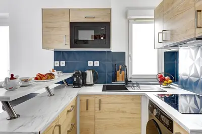 Cuisine ou kitchenette dans l'établissement Suite Petit - Havre de paix au cœur de Paris