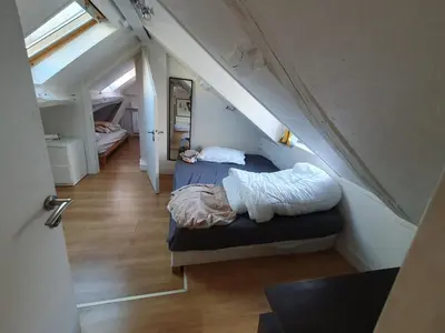 Un ou plusieurs lits dans un hébergement de l'établissement Appartement en duplex avec 3 chambres, au 4e et dernier étage