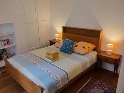 Un ou plusieurs lits dans un hébergement de l'établissement Charming apartment Paris
