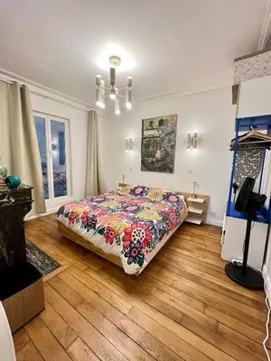 Un ou plusieurs lits dans un hébergement de l'établissement Exceptional apartment in the heart of Paris