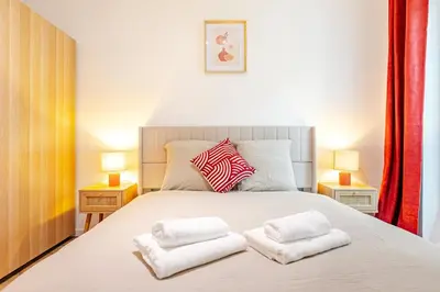Un ou plusieurs lits dans un hébergement de l'établissement Appartement 2 Chambre Bercy Vincennes
