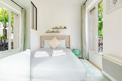 Un ou plusieurs lits dans un hébergement de l'établissement Appartement 2 Chambre Bercy Vincennes