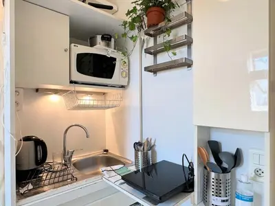 Cuisine ou kitchenette dans l'établissement Charming Studio in Central Paris Near the Seine N1-242