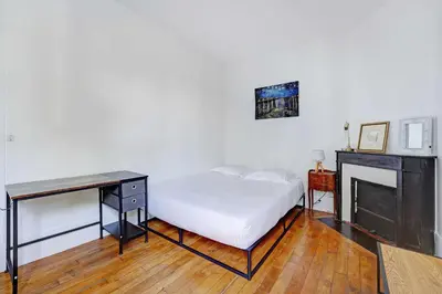 Un ou plusieurs lits dans un hébergement de l'établissement Elegant Apartment 1BR 4P – Paris 15 Montparnasse