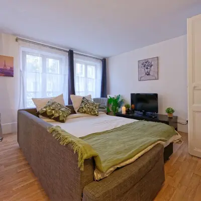 Un ou plusieurs lits dans un hébergement de l'établissement NEW appartement au cœur de Paris