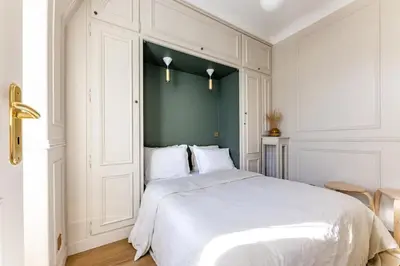 Un ou plusieurs lits dans un hébergement de l'établissement Luxury and comfort on Champs-Élysées