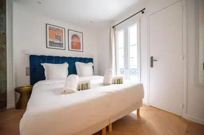 Un ou plusieurs lits dans un hébergement de l'établissement Sweet Home near Place Vendôme