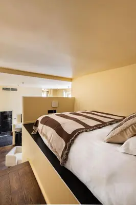 Un ou plusieurs lits dans un hébergement de l'établissement NoChichi-Collections - Residence Saint-Honore