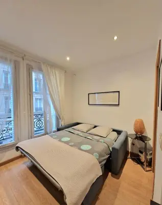 Un ou plusieurs lits dans un hébergement de l'établissement A deux pas de l'Arc de Triomphe Studio tout équipé