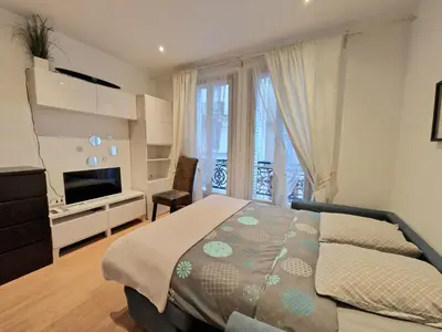 Un ou plusieurs lits dans un hébergement de l'établissement A deux pas de l'Arc de Triomphe Studio tout équipé