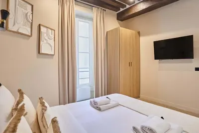 Un ou plusieurs lits dans un hébergement de l'établissement CHarming Apartment in the Center of Paris