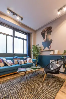 Coin salon dans l'établissement Charming Flat 15 Minutes Montmartre-Sacre-Coeur -Champ Gauche-