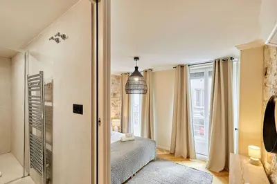 Un ou plusieurs lits dans un hébergement de l'établissement Cozy Apartment Center of Paris