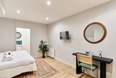 Un ou plusieurs lits dans un hébergement de l'établissement Charming Apartment Center of Paris by Studio Prestige