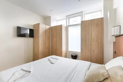Un ou plusieurs lits dans un hébergement de l'établissement Appartement de charme au coeur des Batignolles