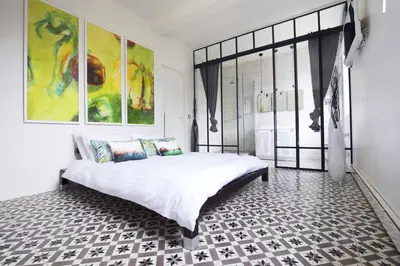 Un ou plusieurs lits dans un hébergement de l'établissement MONTMARTRE ROMANTIC, Bed & Breakfast - Paris