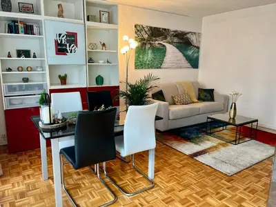 Coin salon dans l'établissement Spacious & Cozy 30 m2 Studio near Eiffel Tower