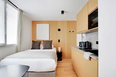 Un ou plusieurs lits dans un hébergement de l'établissement Charming Studio 2P - Place de la République