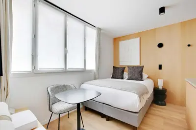 Un ou plusieurs lits dans un hébergement de l'établissement Charming Studio 2P - Place de la République
