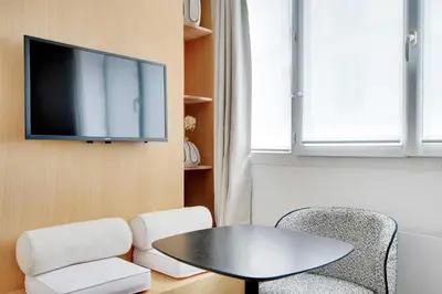 Télévision ou salle de divertissement dans l'établissement Charming Studio 2P - Place de la République