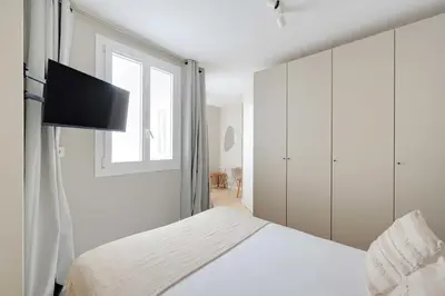 Un ou plusieurs lits dans un hébergement de l'établissement Cosy Studio 2P - Paris 01 Musée du Louvre