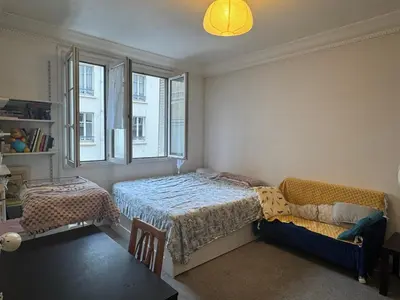 Un ou plusieurs lits dans un hébergement de l'établissement Cozy studio in Paris 13e