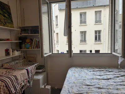 Un ou plusieurs lits dans un hébergement de l'établissement Cozy studio in Paris 13e