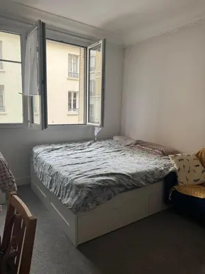 Un ou plusieurs lits dans un hébergement de l'établissement Cozy studio in Paris 13e