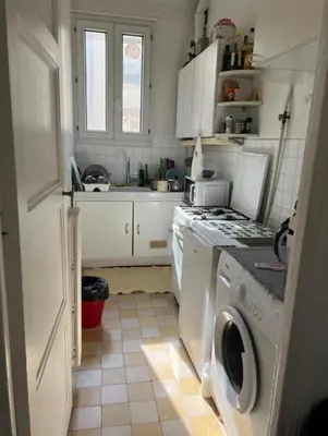 Cuisine ou kitchenette dans l'établissement Cozy studio in Paris 13e