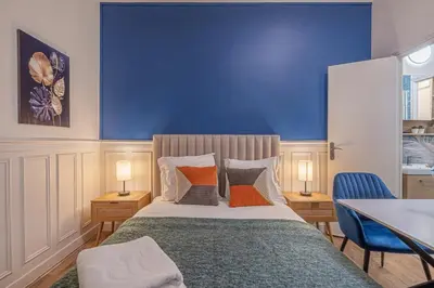 Un ou plusieurs lits dans un hébergement de l'établissement Studio Douillet pour 2 au Cœur de Montmartre - IV