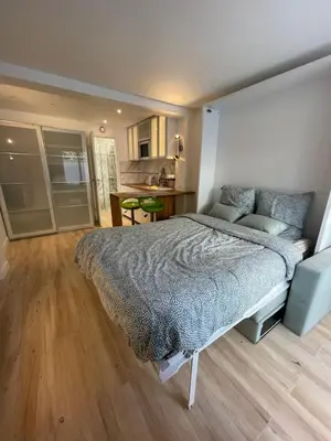 Un ou plusieurs lits dans un hébergement de l'établissement Studio spacieux avec terrasse privée, clim et parking payants