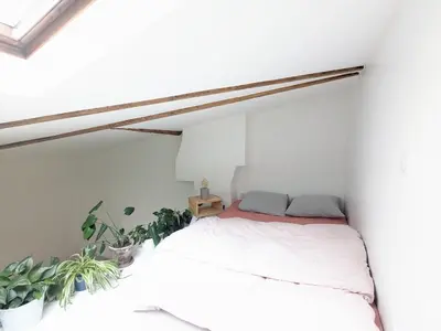 Un ou plusieurs lits dans un hébergement de l'établissement Studio chic et moderne avec mezzanine à 10 min de Montmartre