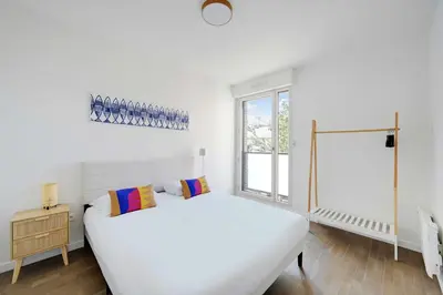 Un ou plusieurs lits dans un hébergement de l'établissement Charming apartment - 2BR-4P- Balcony- Malakoff