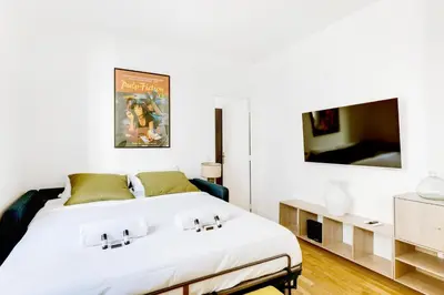 Un ou plusieurs lits dans un hébergement de l'établissement Paris City Center Vibrant