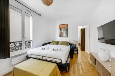 Un ou plusieurs lits dans un hébergement de l'établissement Paris City Center Vibrant