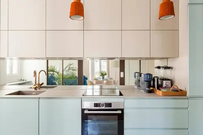 Cuisine ou kitchenette dans l'établissement Boi Cozy Charming Apartment Trocadero
