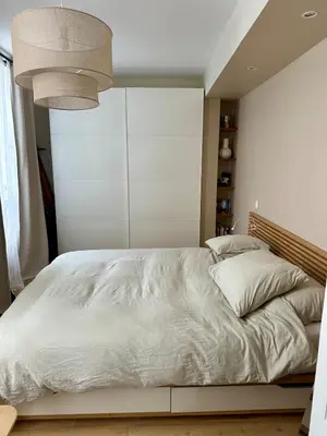 Un ou plusieurs lits dans un hébergement de l'établissement Cosy Parisian flat in the 9th