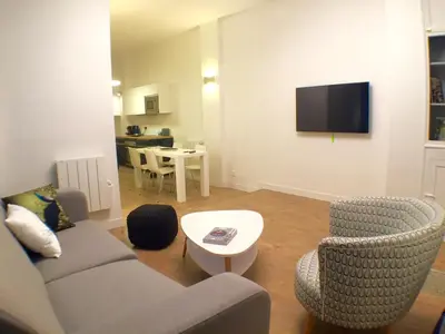 Télévision ou salle de divertissement dans l'établissement The Blue House
