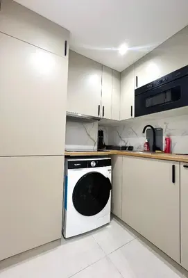 Cuisine ou kitchenette dans l'établissement Nice Flat in West Paris, near Seine