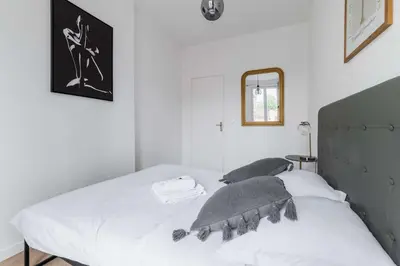 Un ou plusieurs lits dans un hébergement de l'établissement Appartement 40m2 Parc des Expositions - 6P