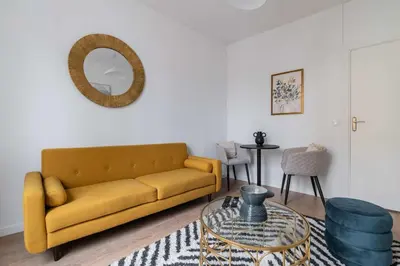 Coin salon dans l'établissement Appartement 40m2 Parc des Expositions - 6P