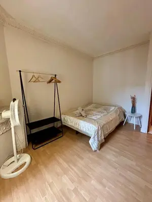 Un ou plusieurs lits dans un hébergement de l'établissement Appartement Convention Fourcade