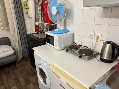 Cuisine ou kitchenette dans l'établissement Bien venu au studio B