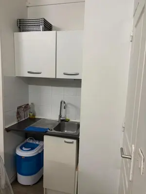 Cuisine ou kitchenette dans l'établissement Bien venu studio A