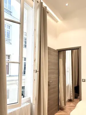 Un ou plusieurs lits dans un hébergement de l'établissement Appartement moderne et rénové au coeur de Paris